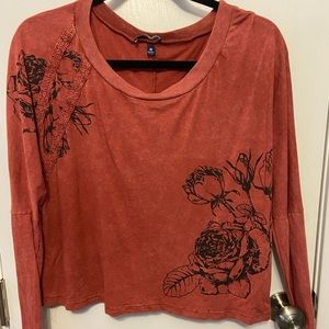 Red long sleeve crop top.